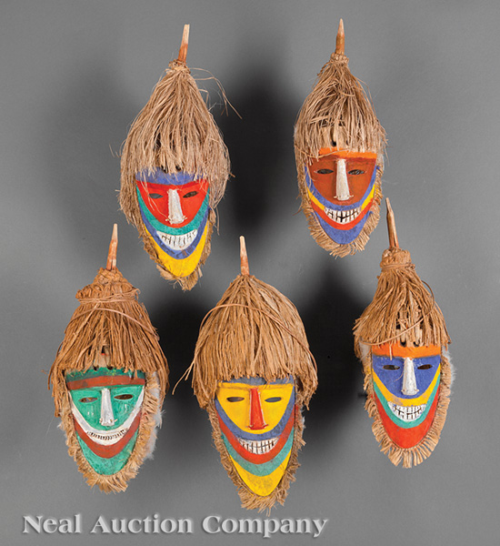 A Group of Five Tolai Polychrome Painted Carved Wood Dance Masks, Gazelle Peninsula, New Britain,