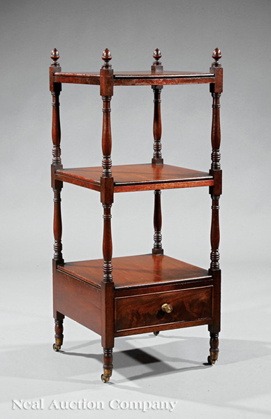 A William IV Mahogany Three Tier Étagère, early 19th c., acorn finials, turned supports, molded