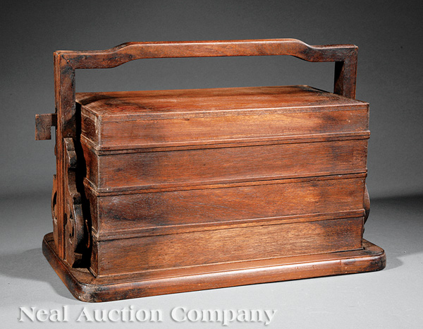 A Chinese Tiered Wood Lunch Box, probably 20th c., three rectangular compartments with fitted