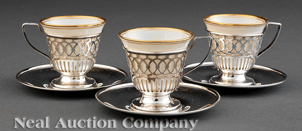 A Set of Twelve Sterling Silver Demitasse Cups and Saucers, with Lenox porcelain liners.