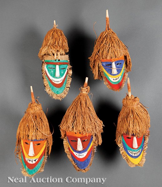 A Group of Five Tolai Polychrome Painted Carved Wood Dance Masks, Gazelle Peninsula, New Britain,