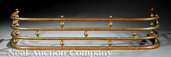 A Brass Fireplace Fender, 19th c., cylindrical crossbars with spherule supports, height 9 in., width