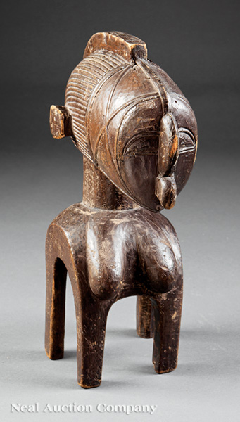 A Baga Carved Wood D`mba Headdress, Guinea, carved as a nude female bust with exaggerated protruding