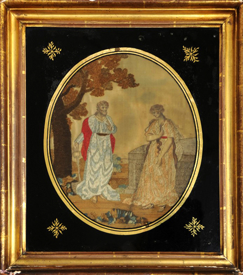 A needlework picture depicting a biblical scene of a lady and gentleman beside a tree. 10 by 12¼ins.