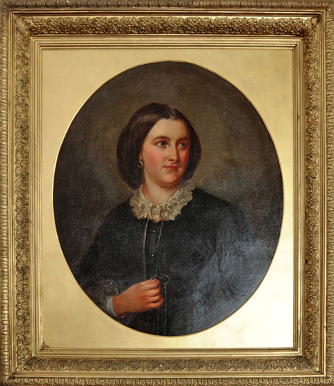 An early 19th century oil on canvas, head and shoulder portrait of a lady with lace collar and cameo