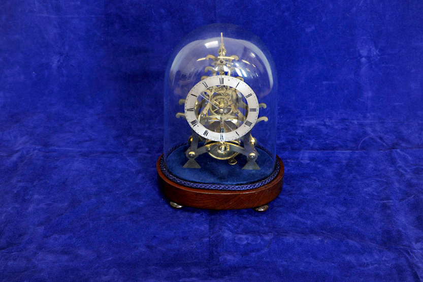 A late 19th century skeleton clock, the silvered chapter ring with Roman Numerals and inscribed `S.