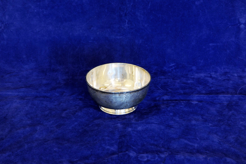 A Victorian silver sugar bowl, the exterior with scroll stylised leaf and swag decoration, on an