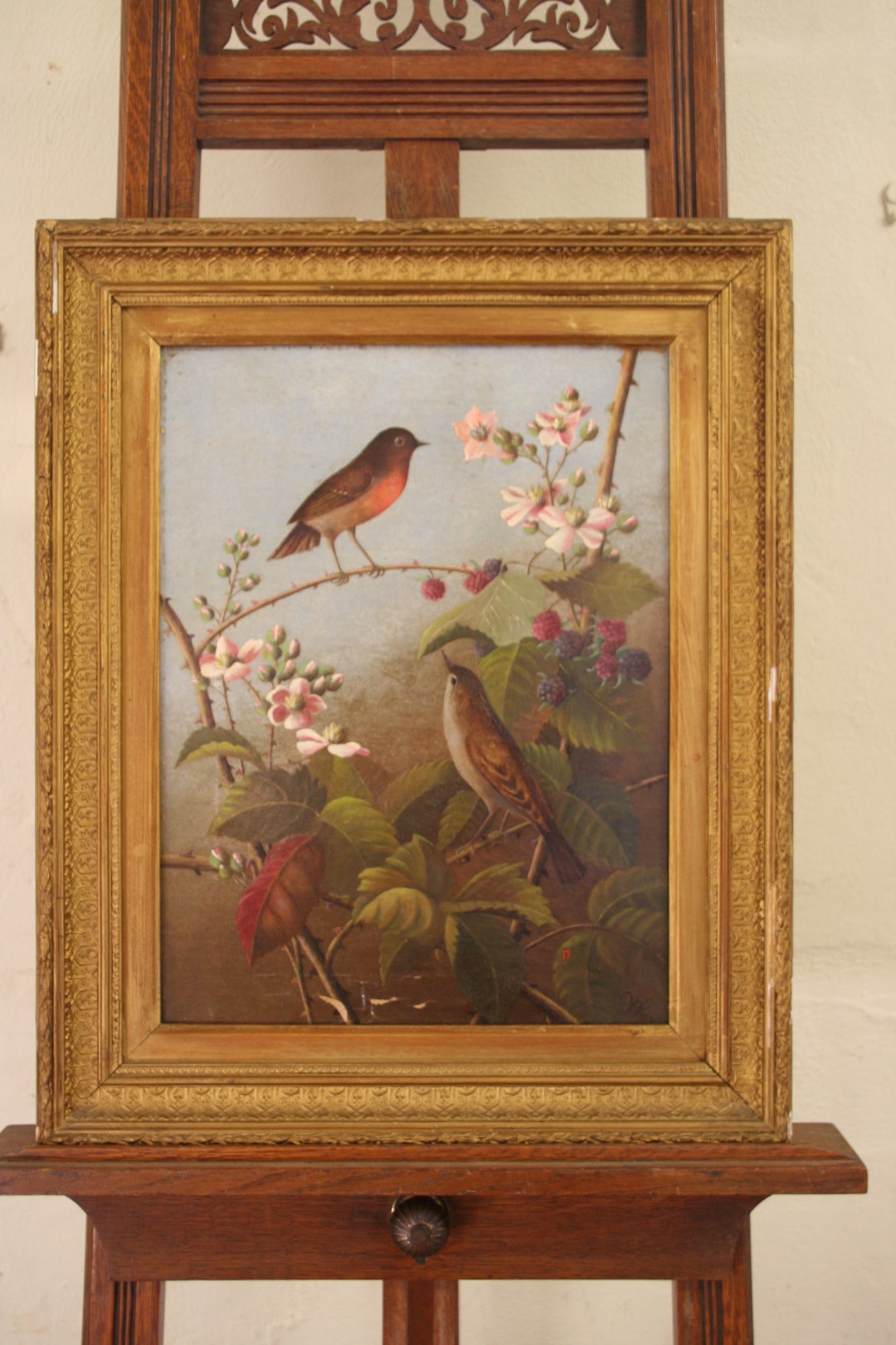 A 19th century oil on canvas of a robin and a thrush in a blackberry bush. Initialled lower right `