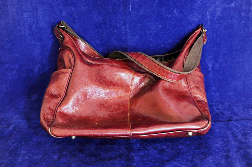 A Jacob red leather bag with shoulder strap.