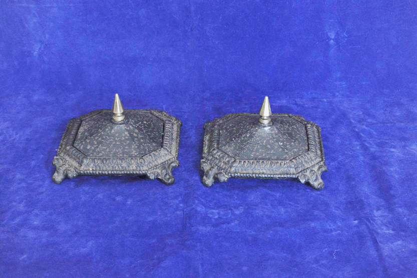 A pair of 19th century wrought iron fireside pots and covers with tapering brass finials to the