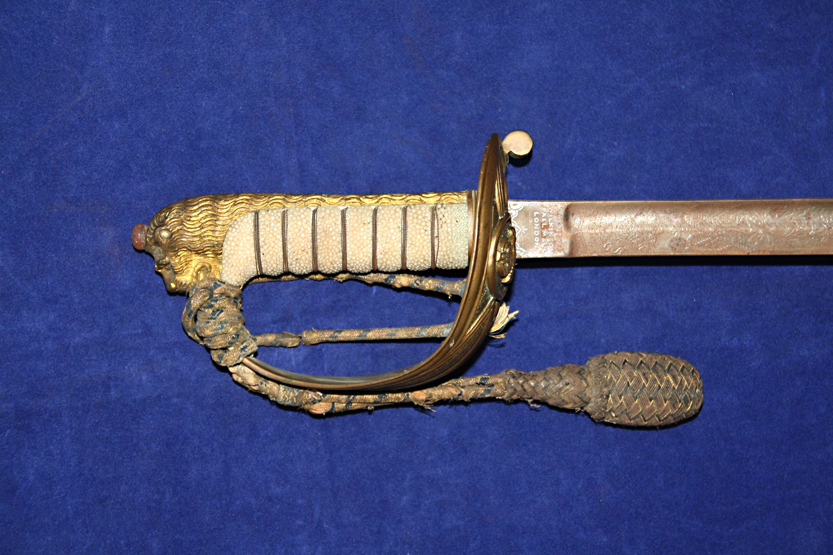 An early 20th century Henry Wilkinson Naval Officer`s sword, previously the property of Commander