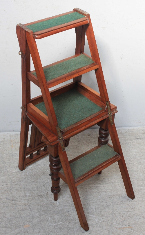 An Edwardian walnut folding library steps-chair with panelled back and plank seat on turned and