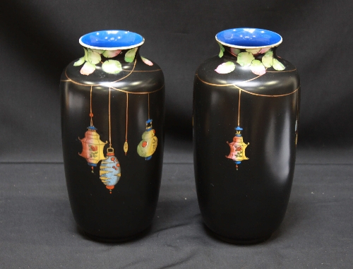 A pair of Regal ware black ground `Shanghai` pattern pottery vases decorated with Chinese lanterns.