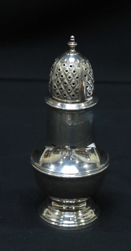 A silver baluster shaped sugar caster, London 1973.