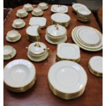 An extensive Royal Doulton dinner service with a cream and gilt pattern comprising of
