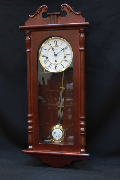 A modern wall clock, with eight-day striking and chiming movement, compensation pendulum, mahogany