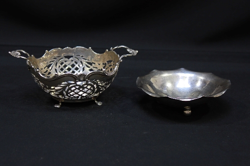 A French silver pierced two handled basket and a circular French bowl on ball feet.