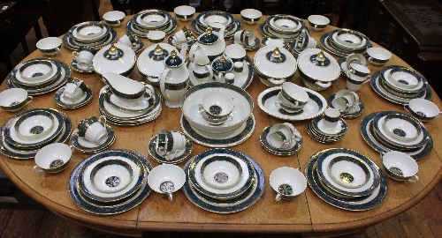 An extensive Royal Doulton `Carlyle` pattern dinner service for twelve places including twelve