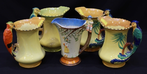 Four 1930`s pottery jugs with parrot handles and another modelled with children `scrumping`, (5).