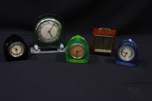 A 1930`s green glass and chromium plated mantel clock and four other 1930`s clocks, (5).