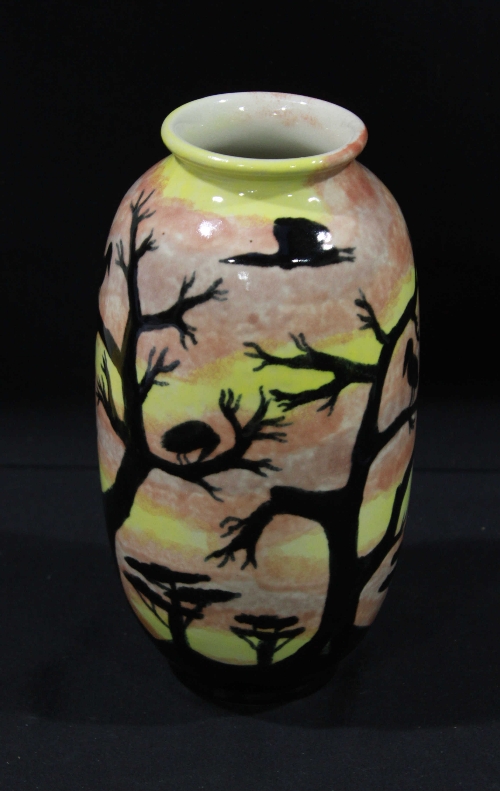 A Cobridge Stoneware pottery vase, of ovoid form, painted with a continuous landscape of birds
