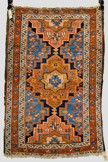 Heriz rug, north west Persia, circa 1920s, 3ft. 11in. x 2ft. 8in. 1.20m. x 0.81m. Overall wear and