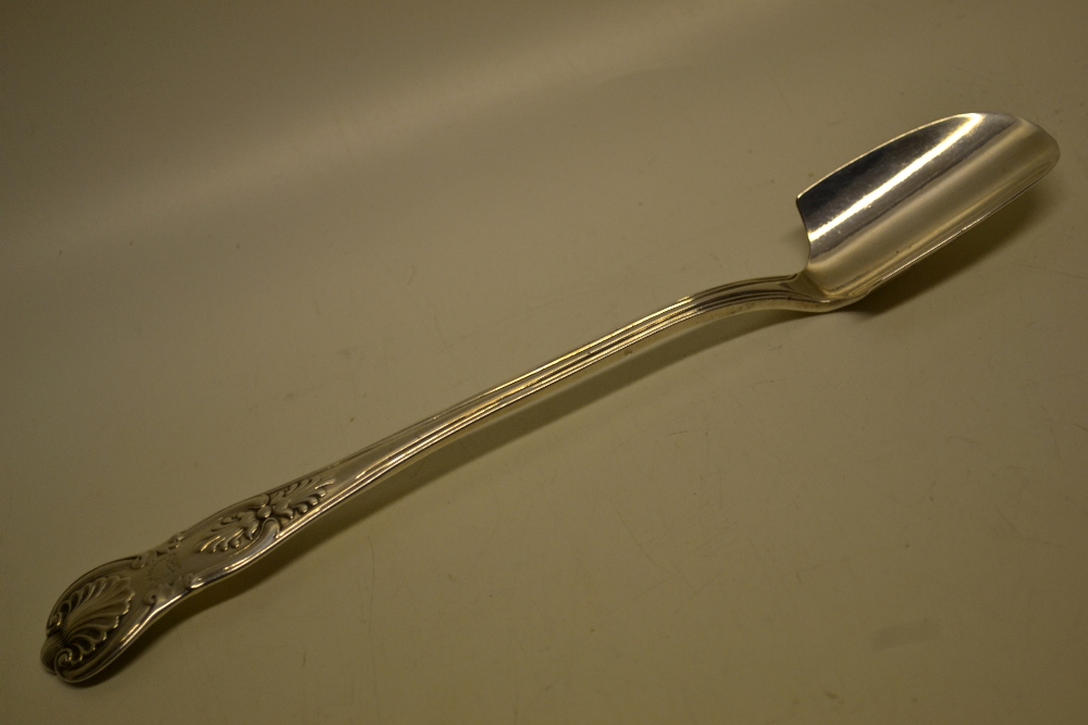 An early Victorian silver King`s pattern stilton scoop, engraved a crest with motto. Maker William