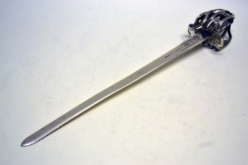 A Scottish silver claymore paper knife, with a pierced basket hilt. 11.5in (29cm). Makers MccKay and