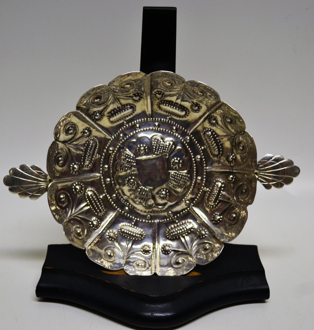 A Charles 1st silver sweetmeat dish, with repousse stylised plants to the raised panelled sides, a