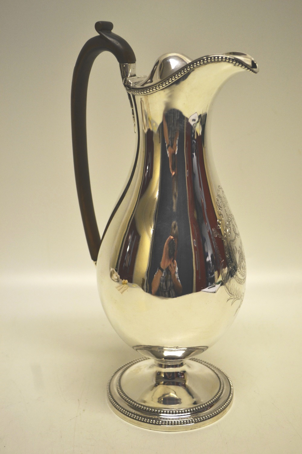 Hester Bateman. A George III silver wine jug, engraved on amorial cartouche to the baluster body