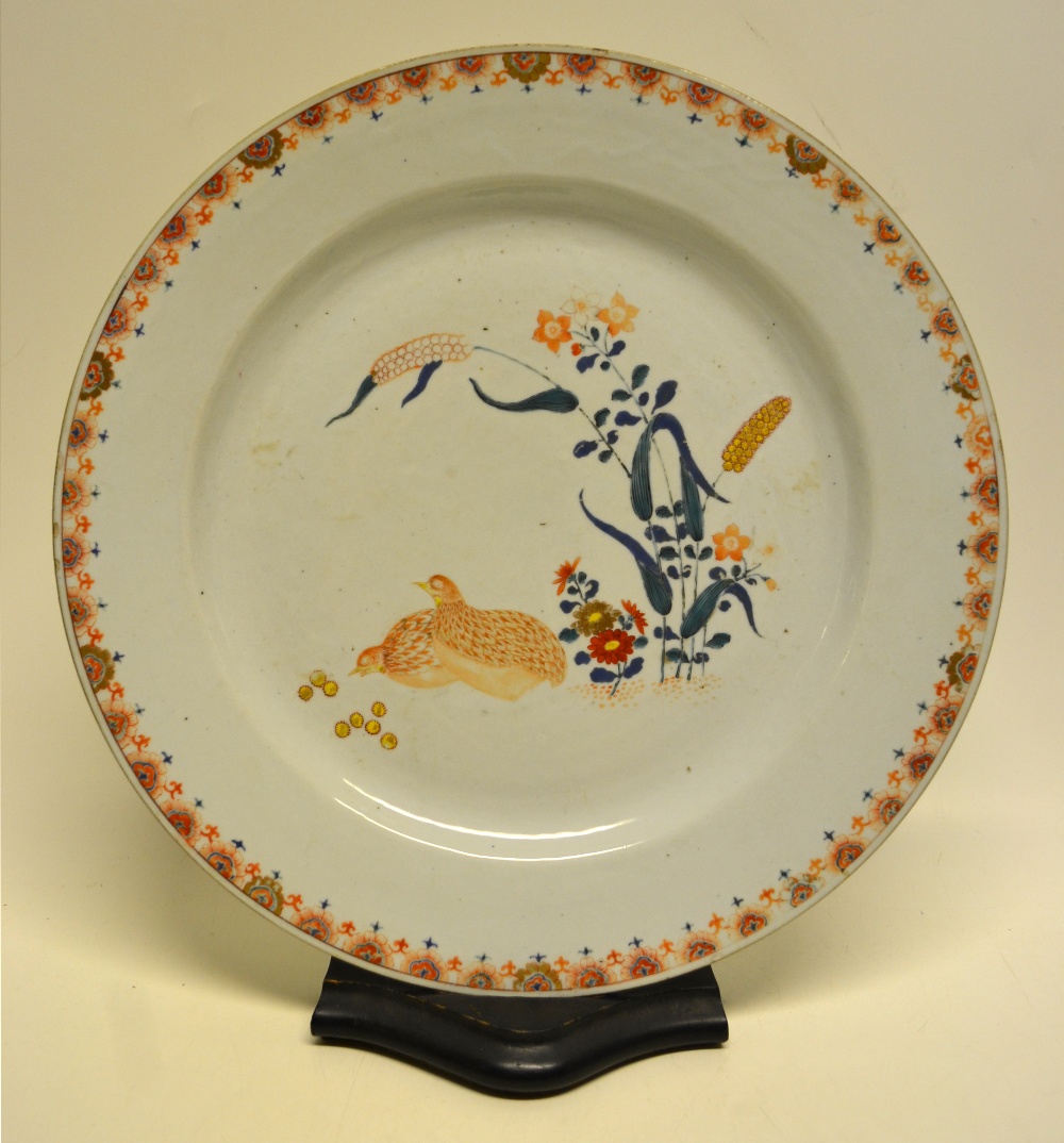 An early eighteenth century Chinese porcelain charger decorated quail and ears of corn with