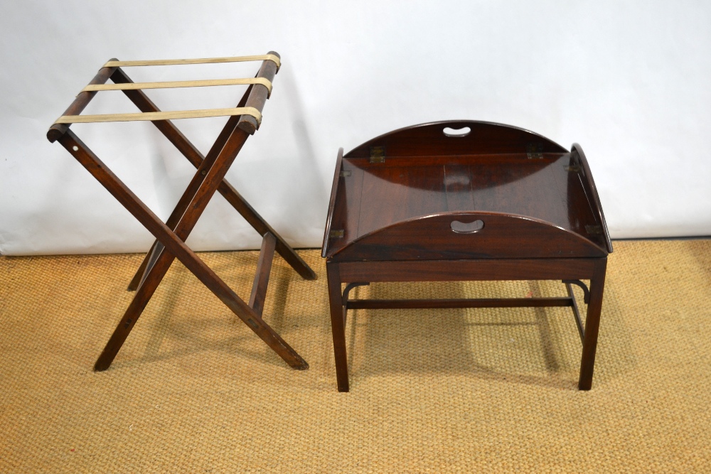 A mahogany oval butlers tray, with pierced hand grips to the hinged side flaps. 26in 66cm, (closed.)