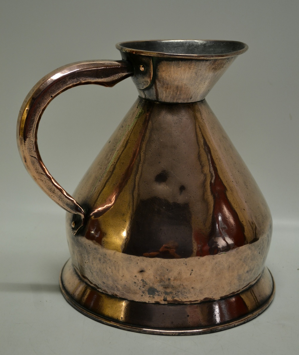 An Edwardian copper gallon jack by Farrow and Jackson of London, having a scroll handle on a skirt