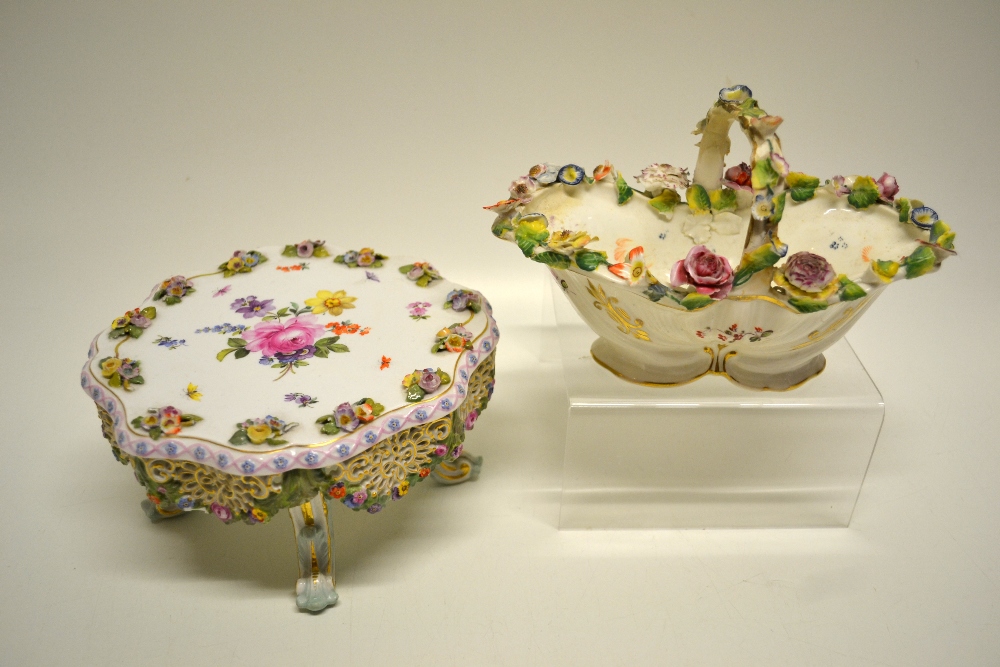 A nineteenth century Meissen porcelain table display stand, the circular top painted flowers and