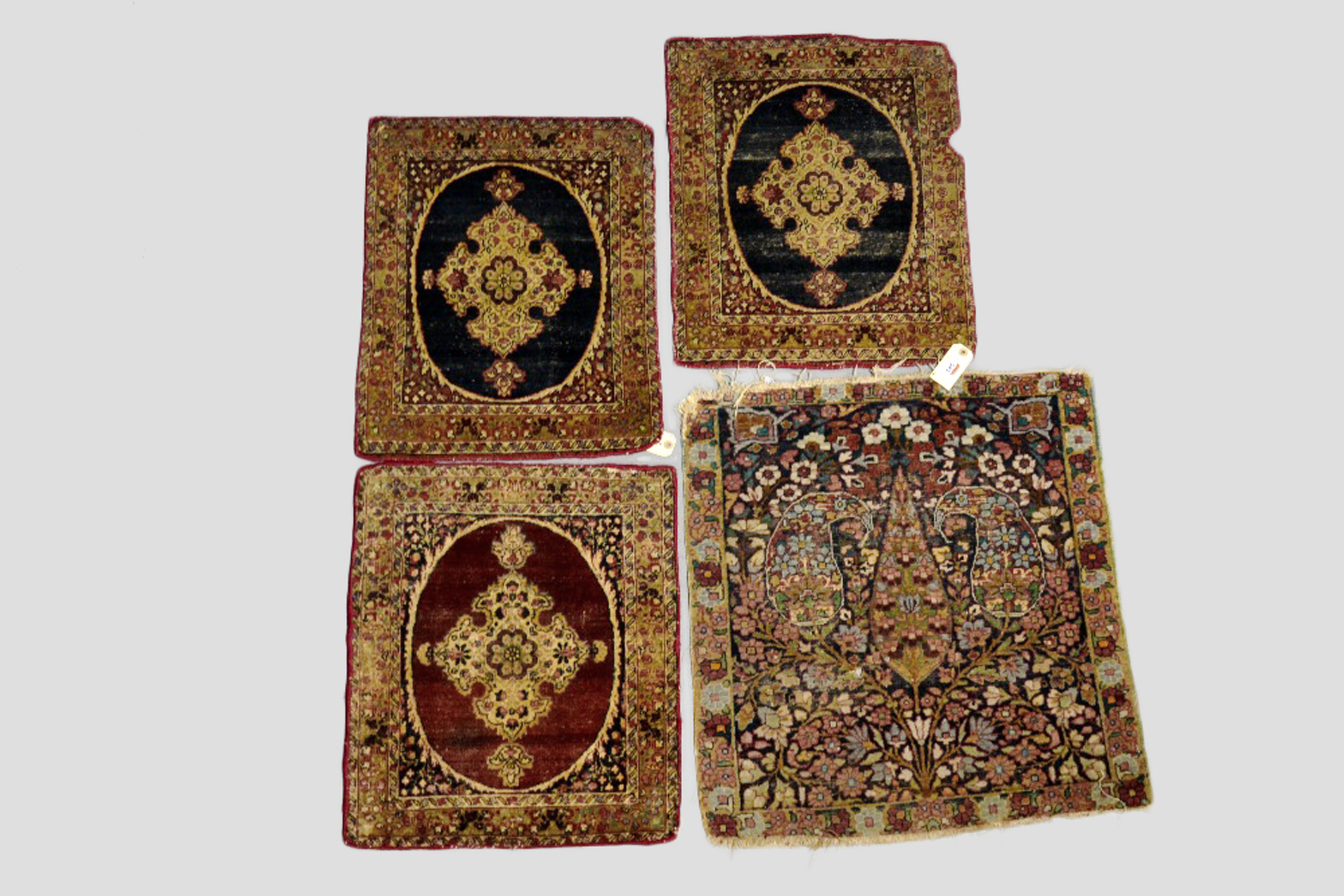 Four Kerman mats, south west Persia, early 20th century. Sold as a collection with all faults not