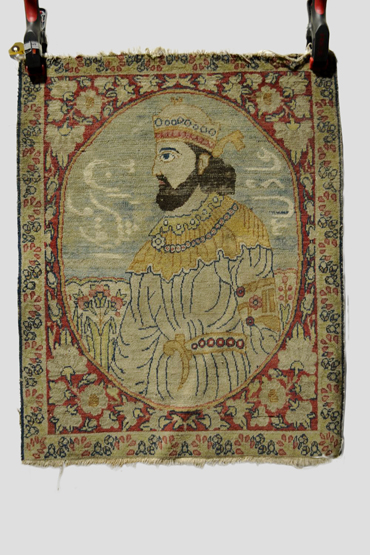 Ravar Kerman pictorial mat, south west Persia, early 20th century, with portrait and inscription.