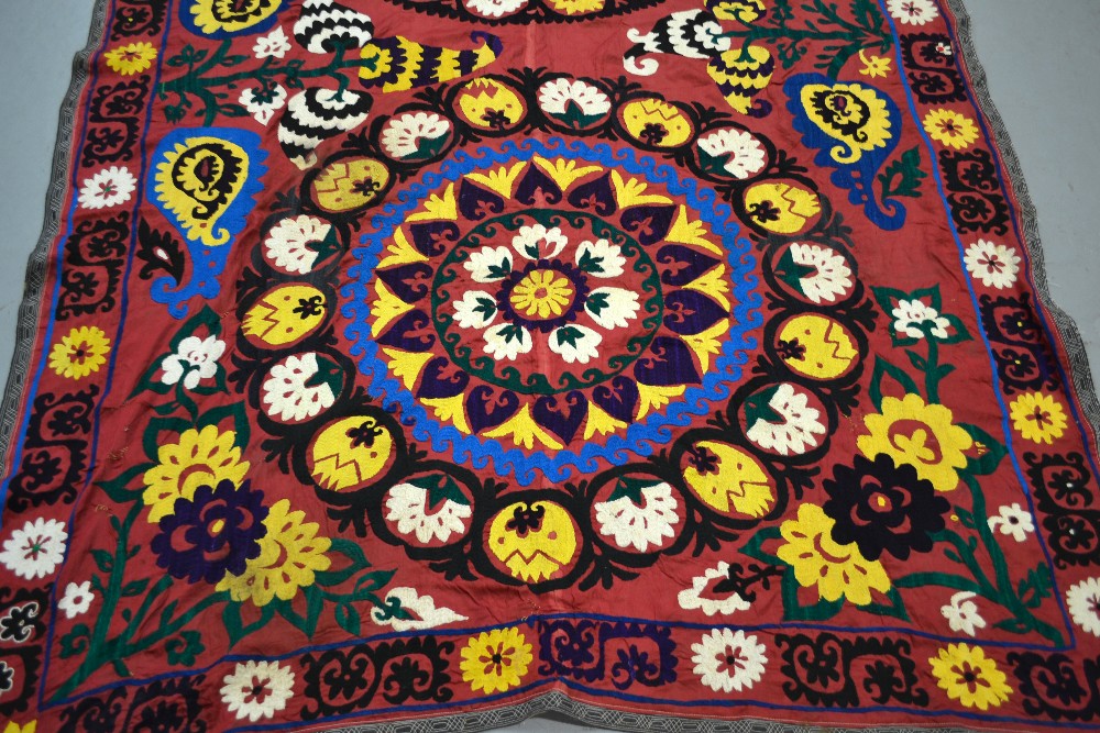Atttractive Uzbek suzani, plum silk ground embroidered in bright silks in basma stitch, Samarkand, - Image 2 of 2