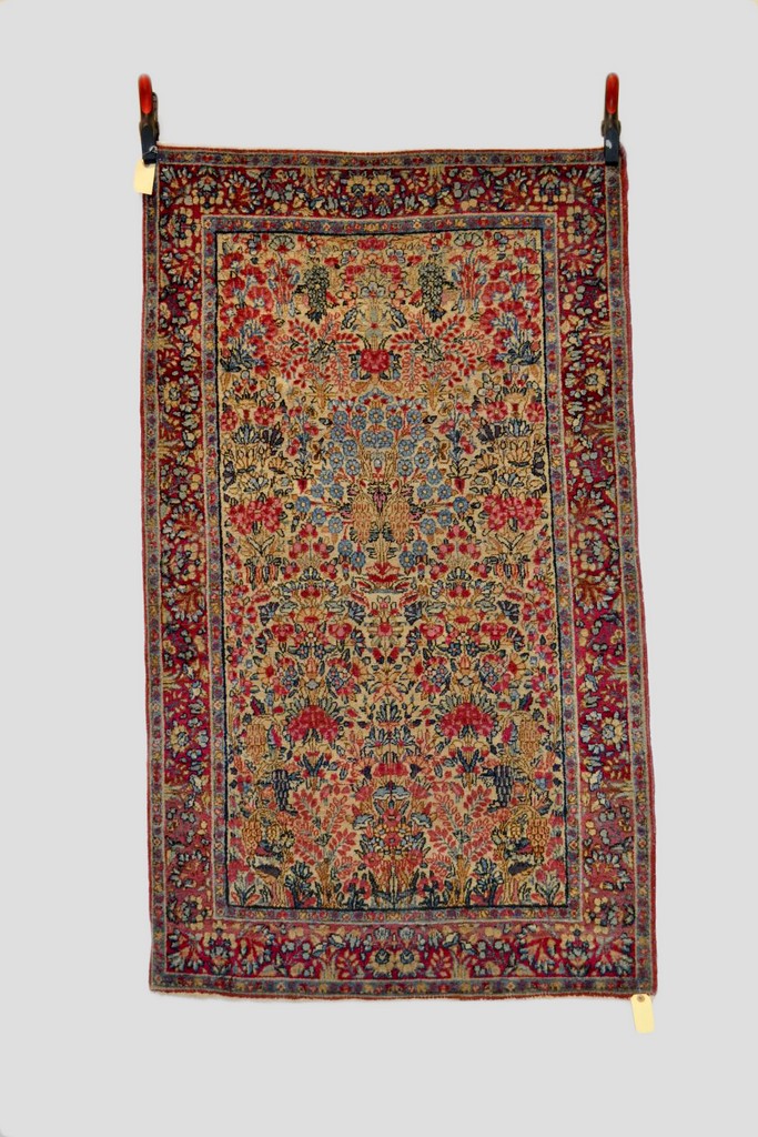 Kerman rug, south west Persia, about 1950s, 5ft. 1in. x 3ft. 1.55m. x 0.91m. Overall even wear.