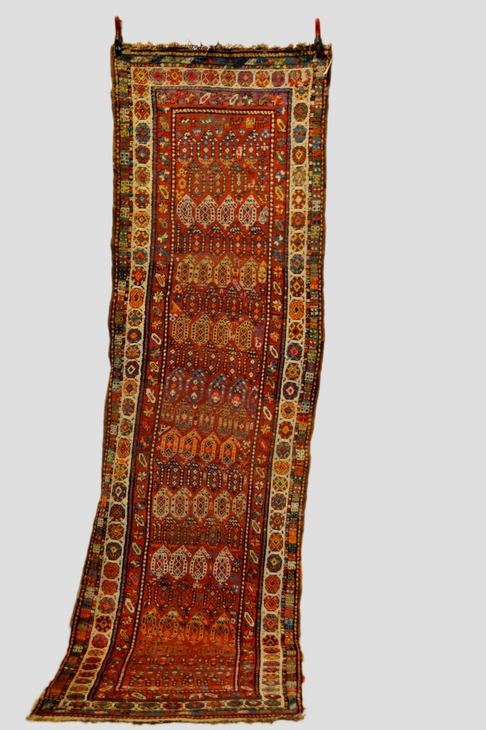 Kurdish runner, north west Persia, about 1920-30s, 11ft. 5in. x 3ft. 5in. 3.48m. x 1.04m. Slight