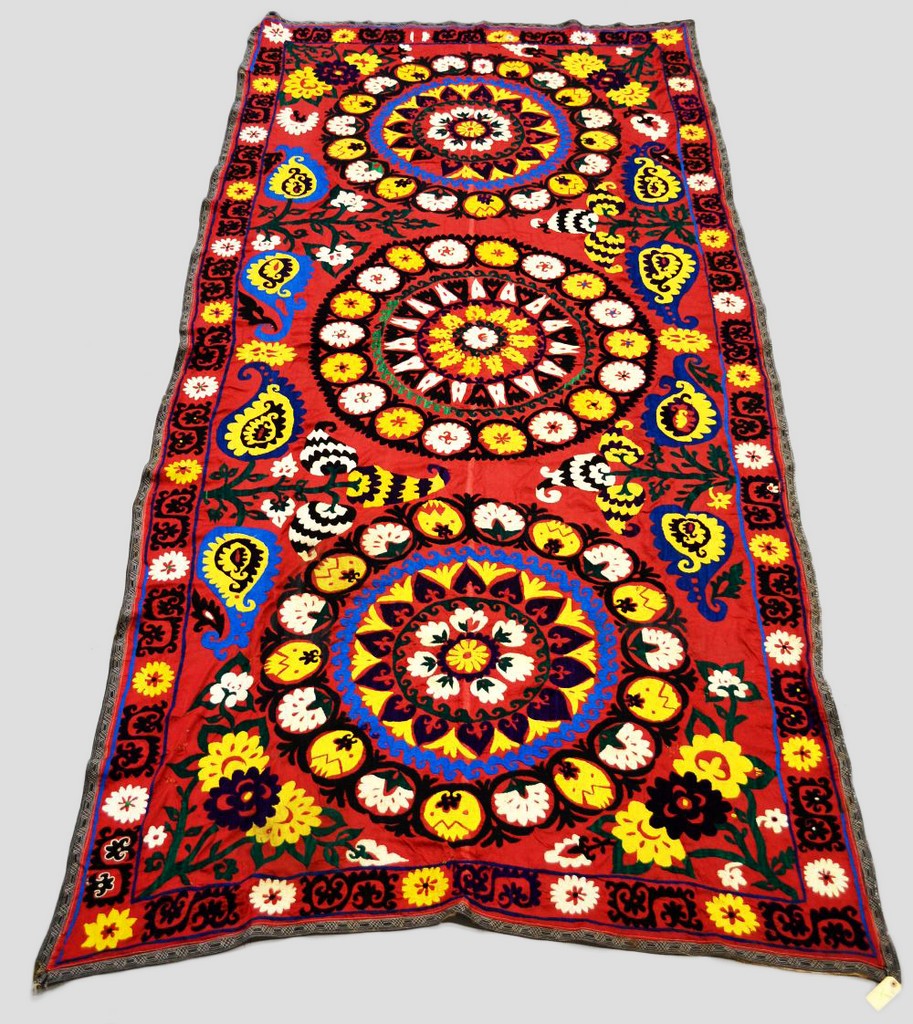 Atttractive Uzbek suzani, plum silk ground embroidered in bright silks in basma stitch, Samarkand,