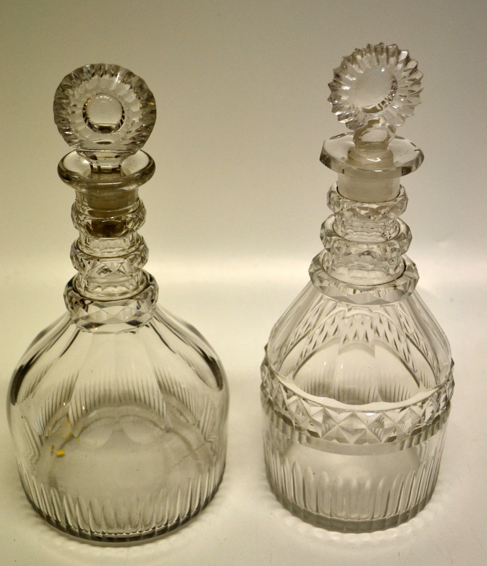 Two Regency cut glass decanters with target stoppers.
