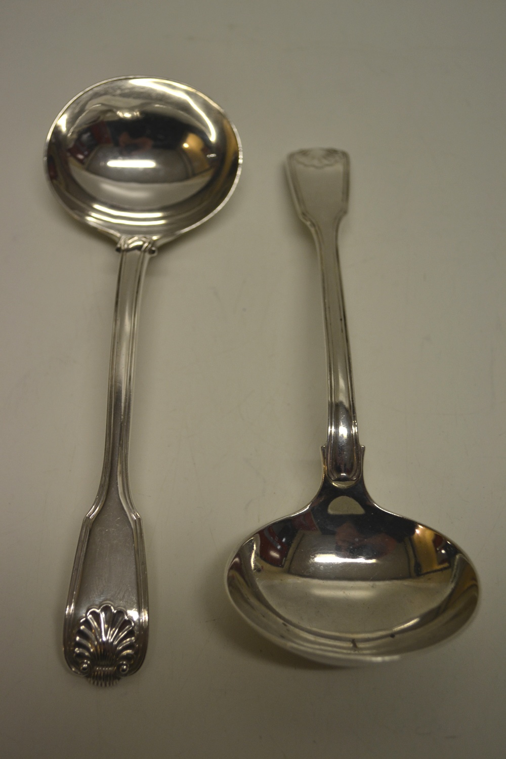 A pair of William IV silver fiddle thread and shell pattern sauce ladles. Makers Joseph and Albert