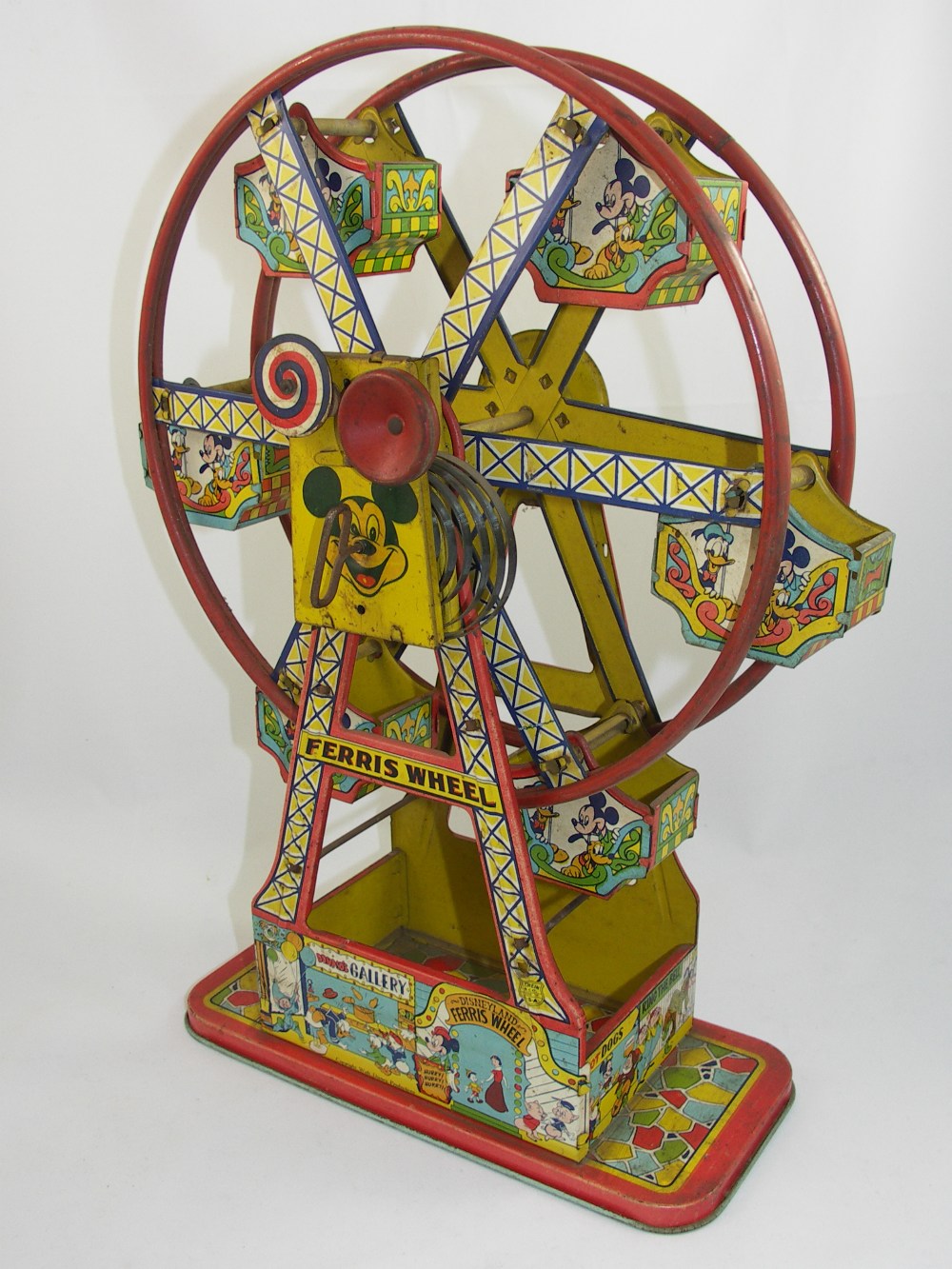 Disneyana -  A Mickey Mouse tinplate ferris wheel  with six gondolas, lithographic decoration with