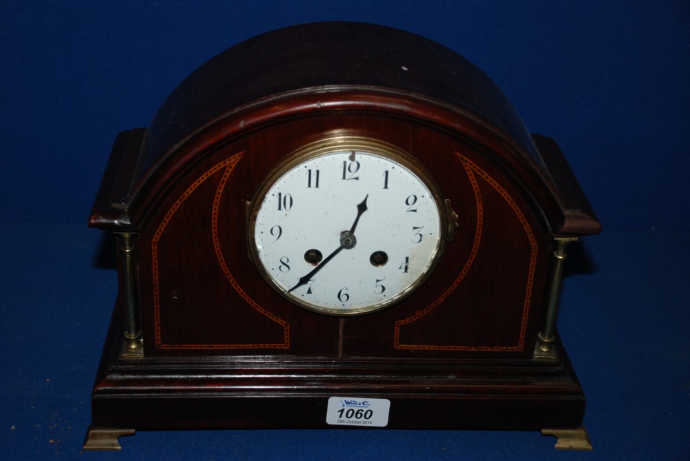 A wooden cased mantle Clock