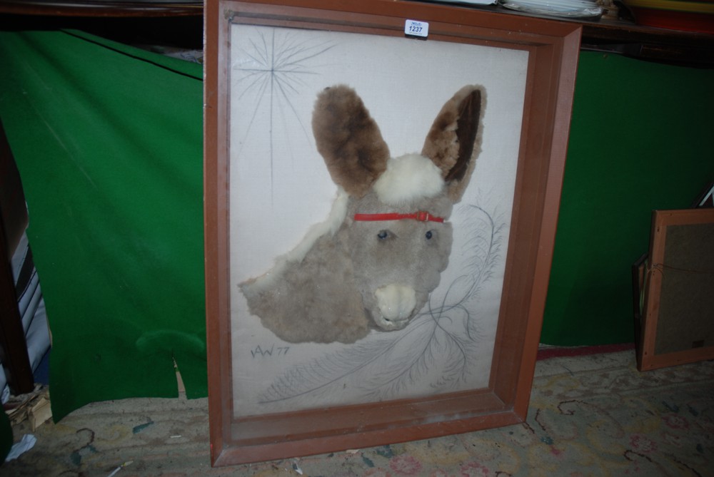 A donkey Coat fashioned into a donkey head picture.  30'' x 34''