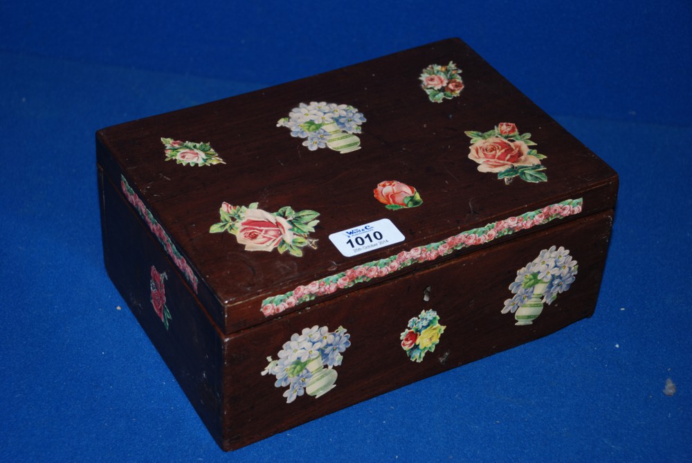 A decorative wooden Box decorated with flowers