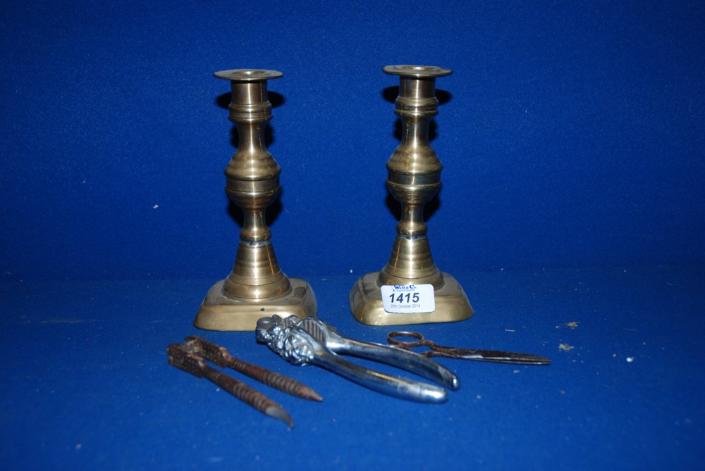 A pair of Brass Candlesticks, 7'' tall, two pairs of nutcrackers etc.