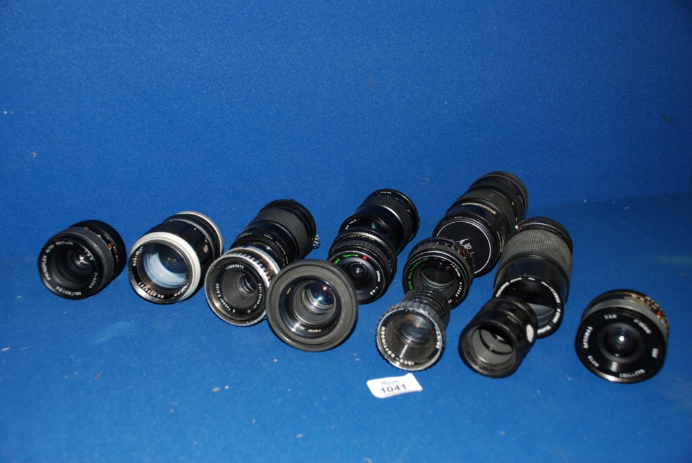 A collection of lenses including Rollei Planar, Zeiss Tessar etc.