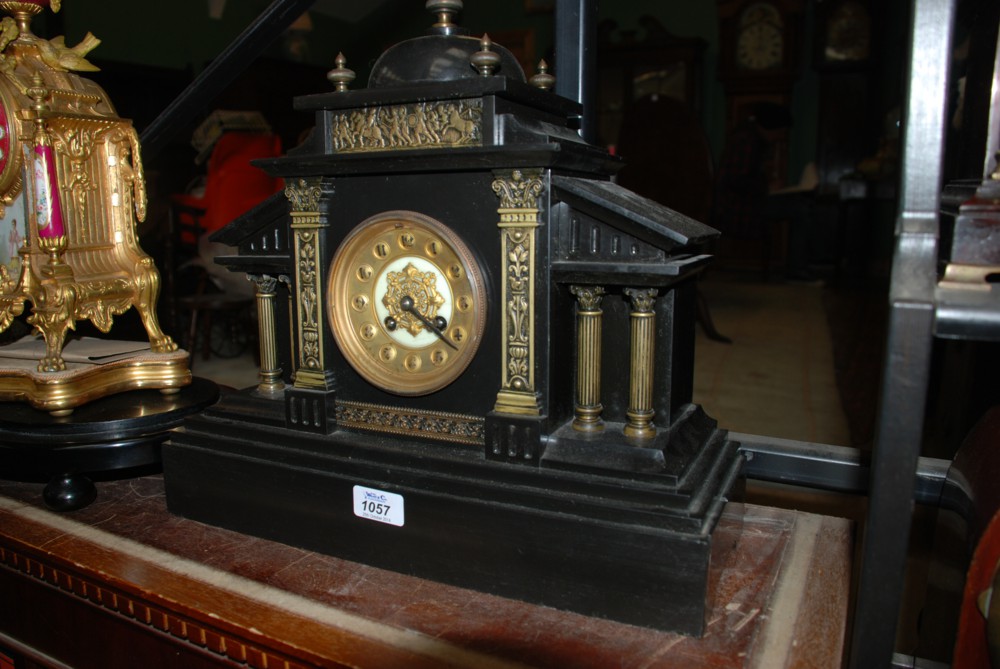 A heavy black Marble Clock in the shape of a palladium building
