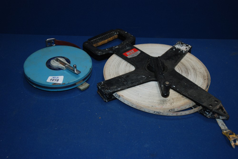 A RST 100m Tape Measure along with a Fibron 30M Tape Measure